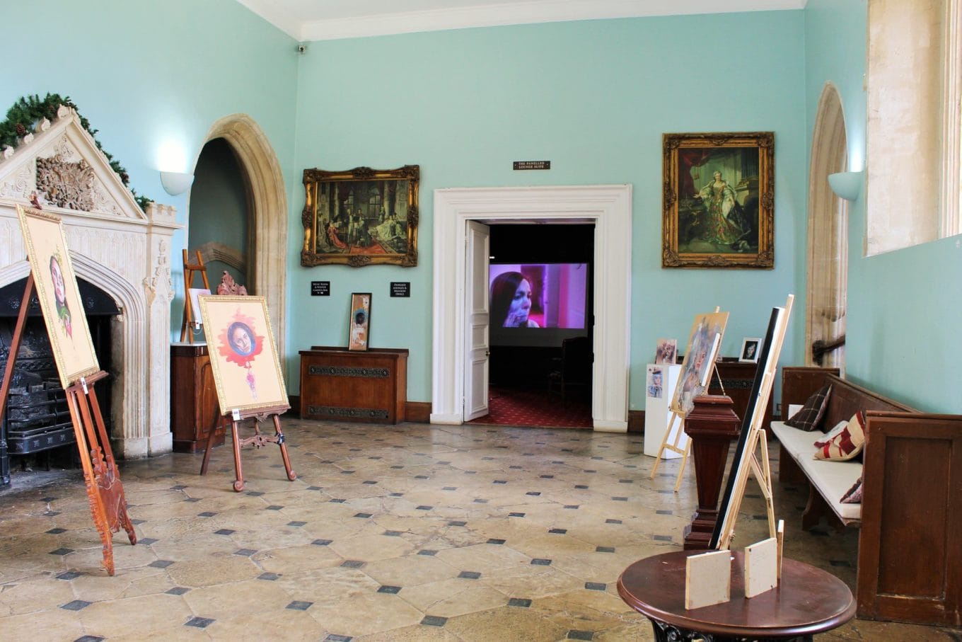 Artworks from Rebecca Lesley's solo exhibition are on easels in the Great Hall with a film by the artist playing in the Inner Hall. 
