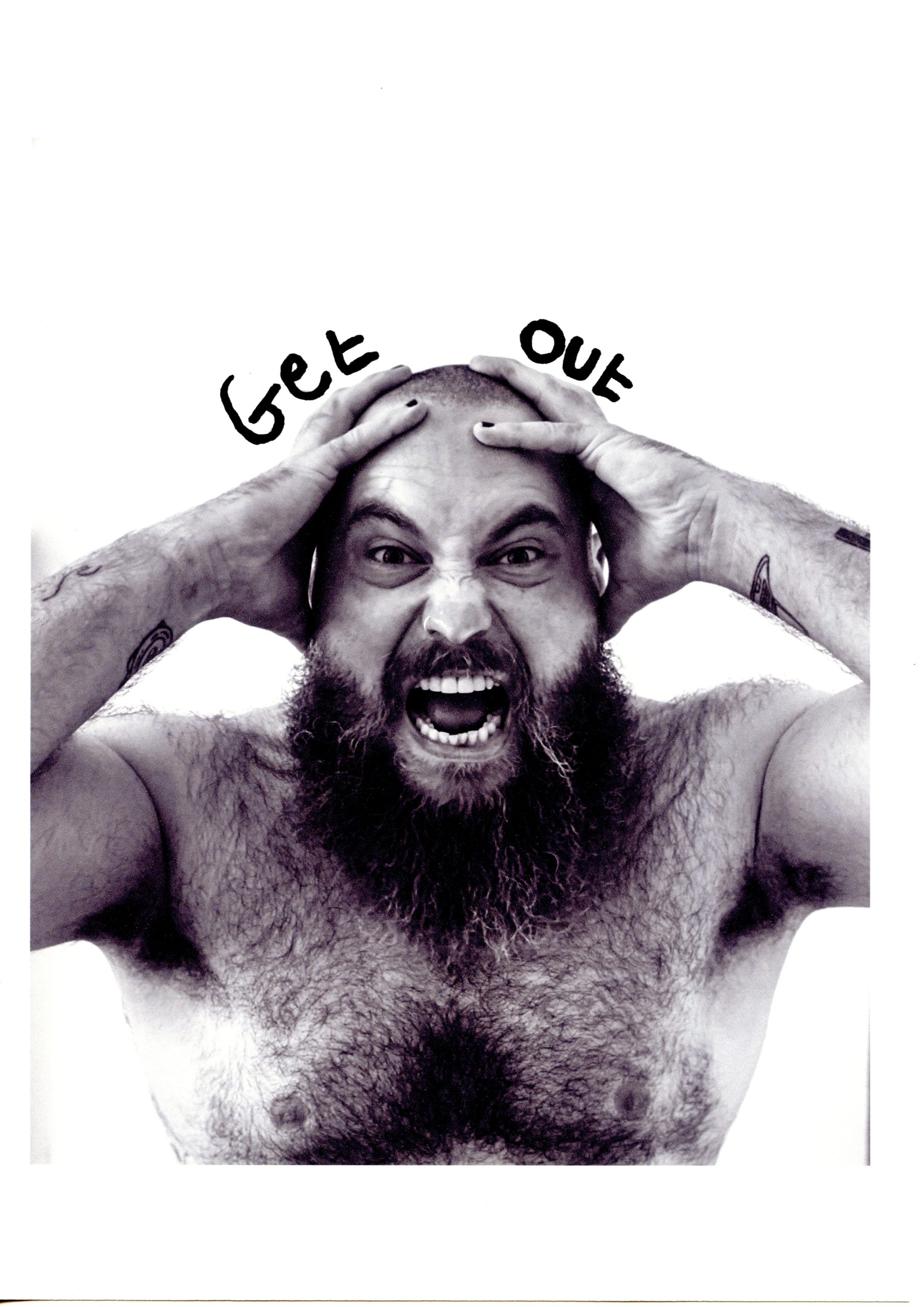 Porttait photo of artist Jacob Dear, topless, holding his head and screaming with the words 'Get Out' written above his head.