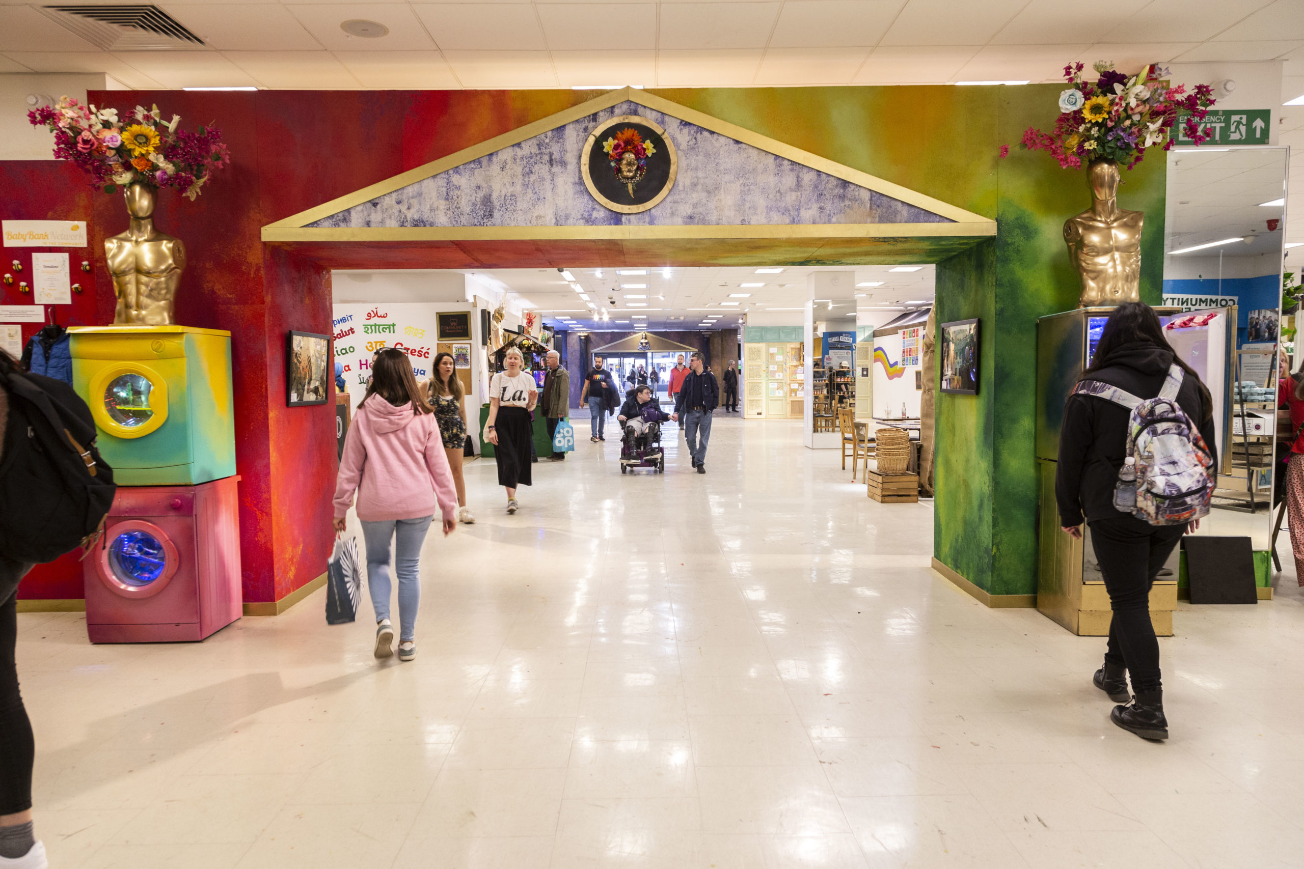 A large. colourful walkway in a department store