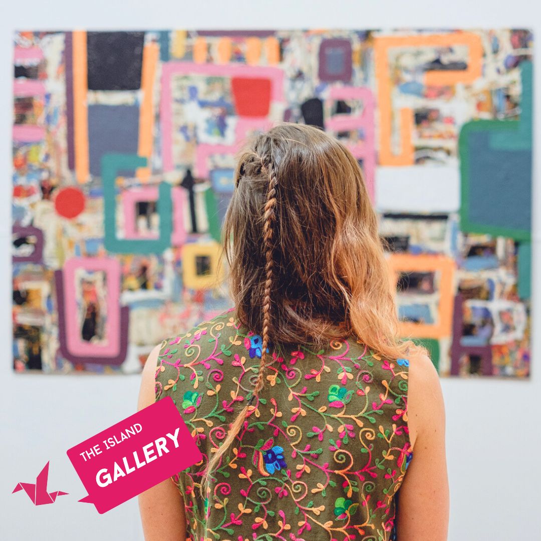 Backshot of a person looking at a large painting on a gallery wall