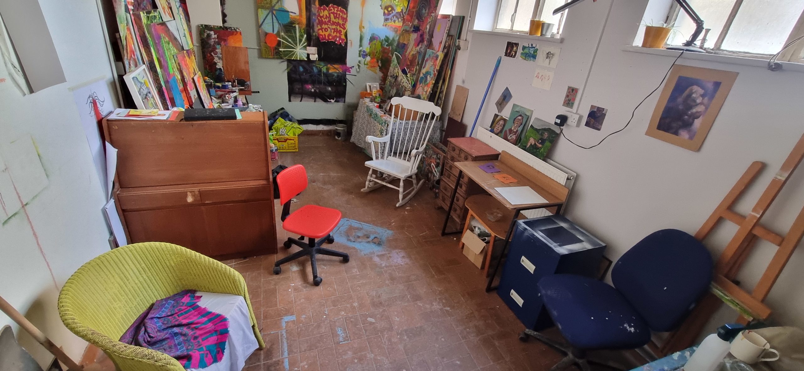 Photo of an artist studio with mismatched furniture