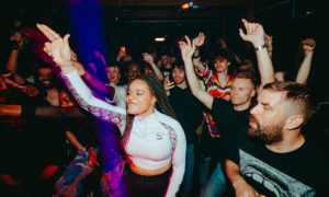 A clubnight danceloor silled with people dancing.